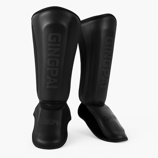 Protège-tibia pour homme en cuir résistant, idéal pour la pratique du Muay Thaï, couleur noire, marque GINGPAI.